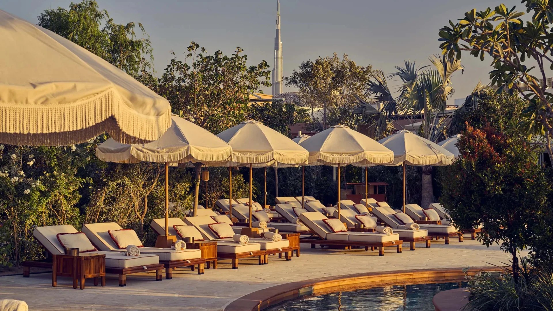Fringed parasols along the pool at Gigi Rigolatto
